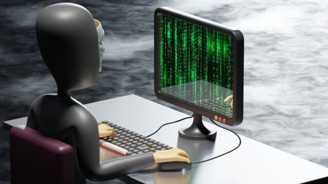 a figure portraying a hacker looking at binary code on a screen